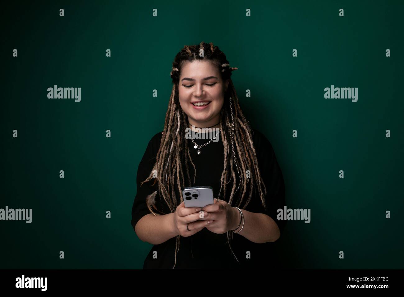 Woman dreadlocks holding cell hi-res stock photography and images - Alamy
