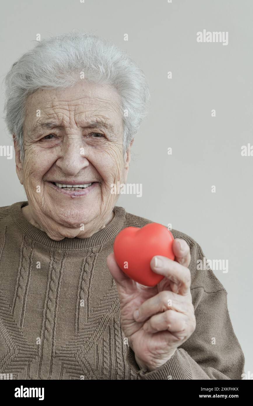 Happy mature woman heart hi-res stock photography and images - Alamy