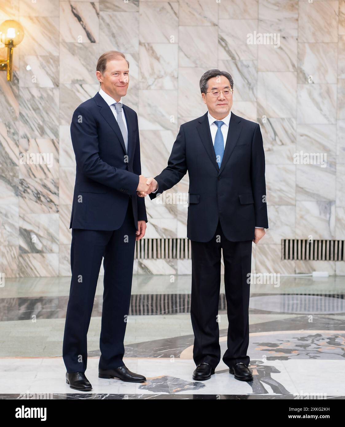 Moscow, Russia. 22nd July, 2024. Chinese Vice Premier Ding Xuexiang, also a member of the Standing Committee of the Political Bureau of the Communist Party of China Central Committee, and Russian First Deputy Prime Minister Denis Manturov hold talks and co-chair the 11th meeting of the China-Russia Investment Cooperation Committee, in Moscow, Russia, July 22, 2024. Credit: Li Tao/Xinhua/Alamy Live News Stock Photo