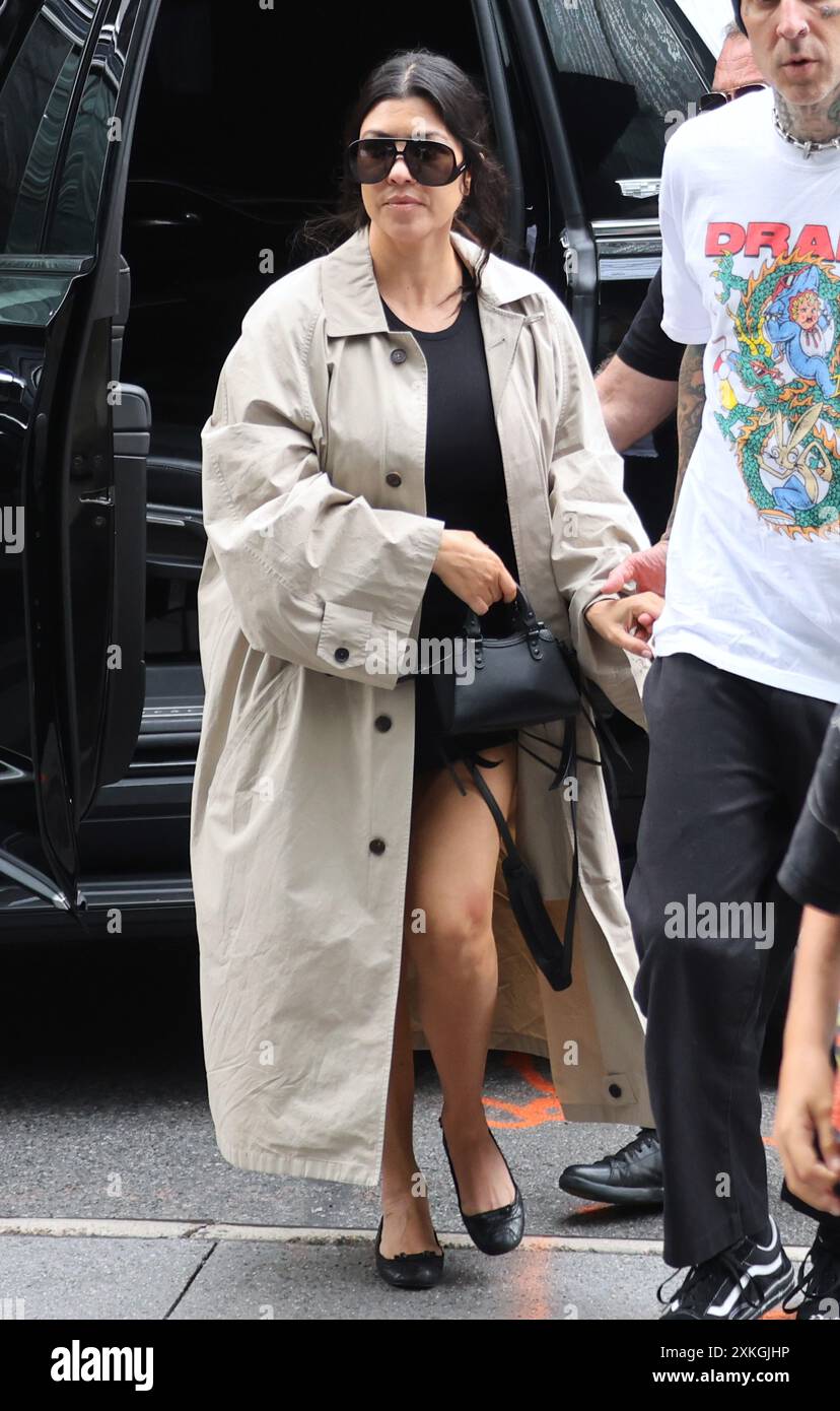 New York, USA. 22nd July, 2024. Kourtney Kardashian and Travis Barker with  Kourtney's son Mason having lunch at Spicy Moon restaurant before heading  to their hotel in New York on July 22,, image size:828x1390