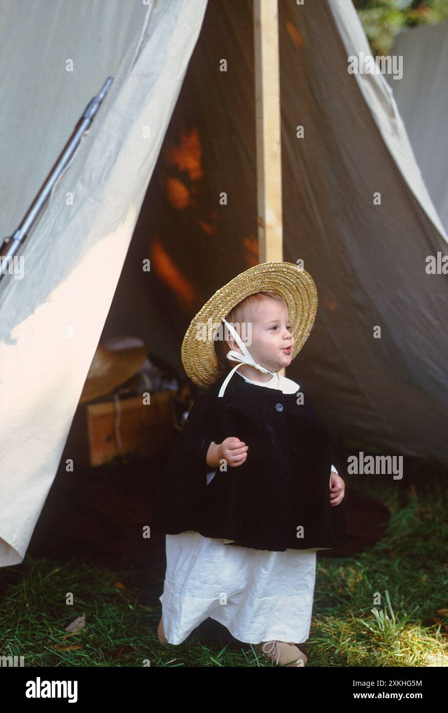 Young girl with straw hat at Revolutionary War encampment & reenactment; Brandywine Battlefield Park; Chadds Ford; Pennsylvania; USA Stock Photo