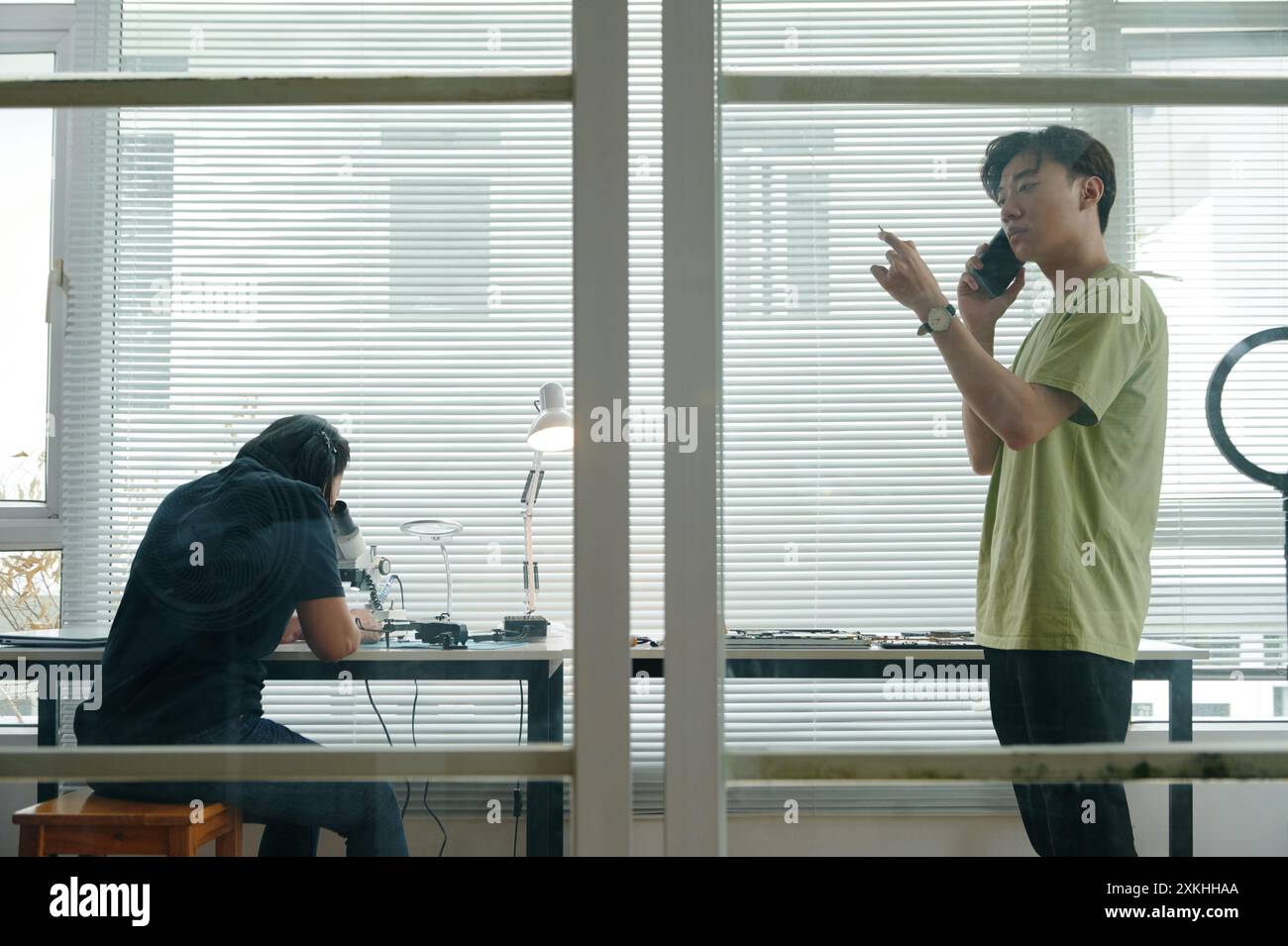 Colleagues Working With Computers At Different Workstations Stock Photo