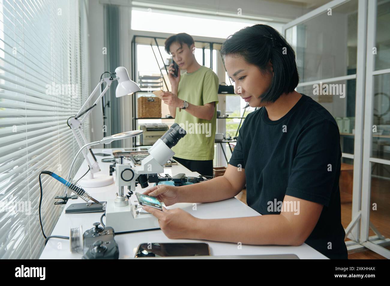 Colleagues Working In Computer Repair Service Stock Photo