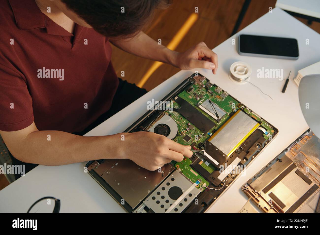 Repairman Working With Board Of Computer Stock Photo