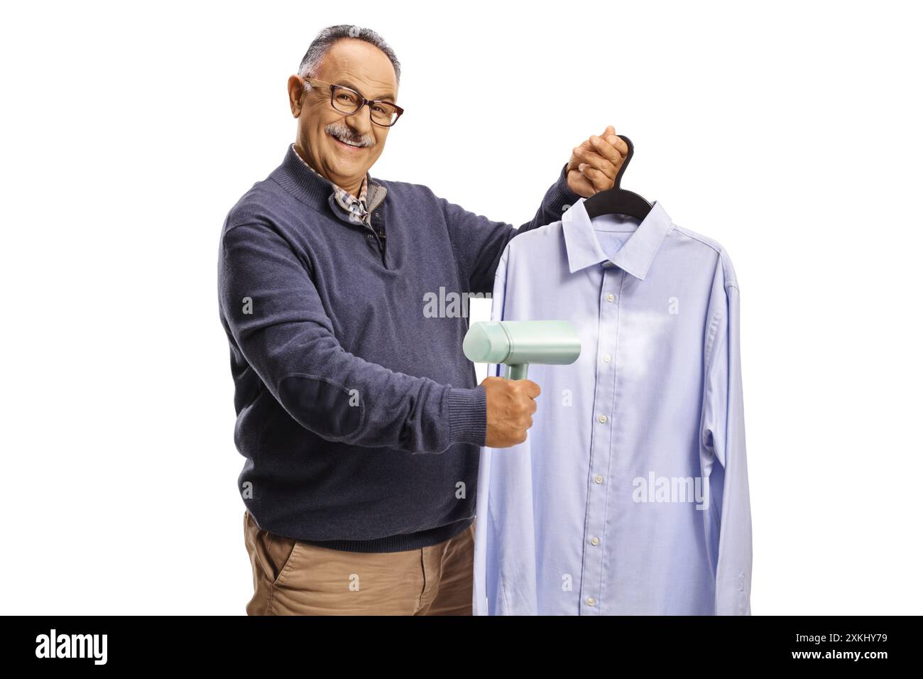 Mature man using a hand steam iron for a shirt isolated on white background Stock Photo