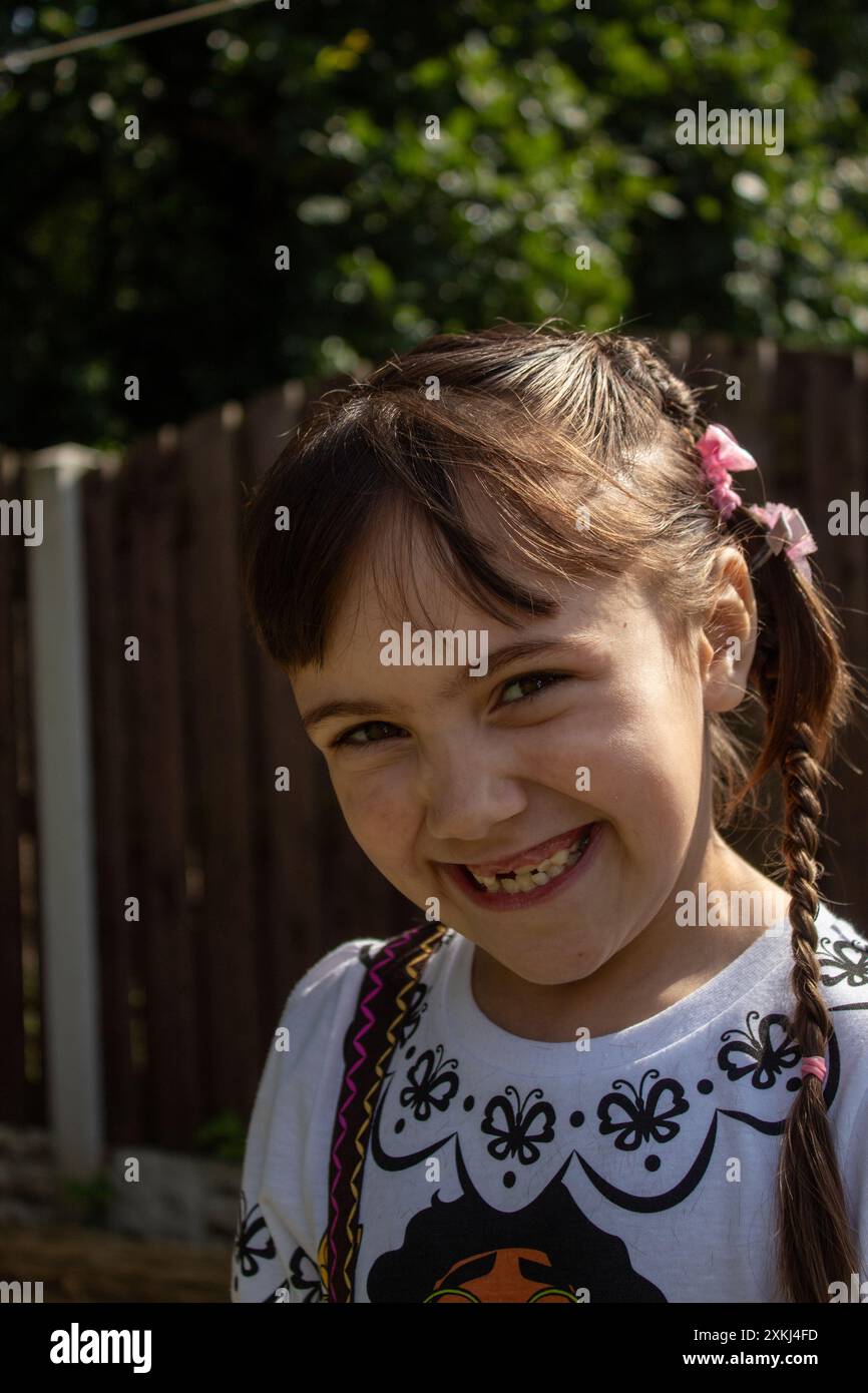 cute smiling little girl in the garden Stock Photo - Alamy