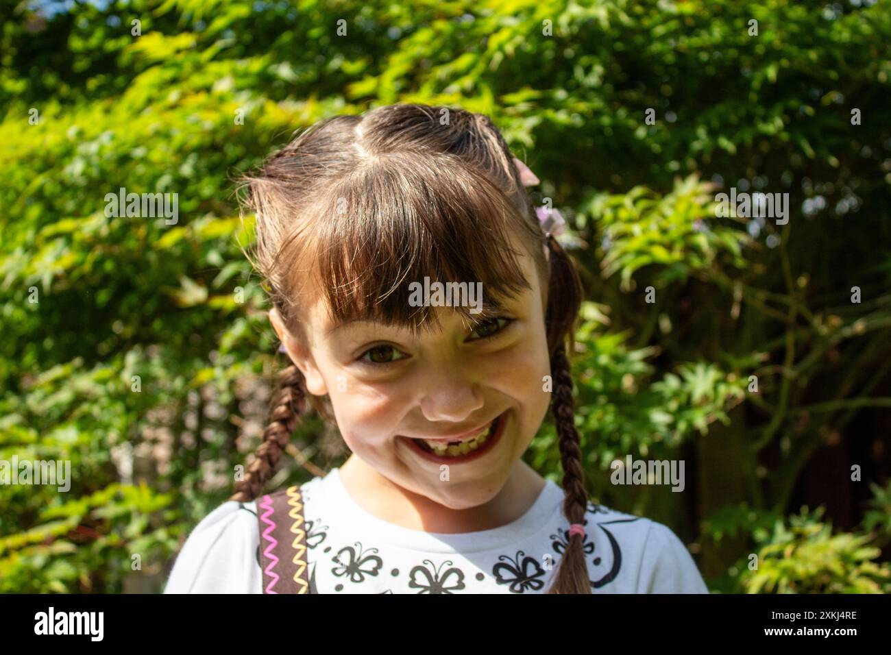 little child girl smiling outside in nature Stock Photo - Alamy