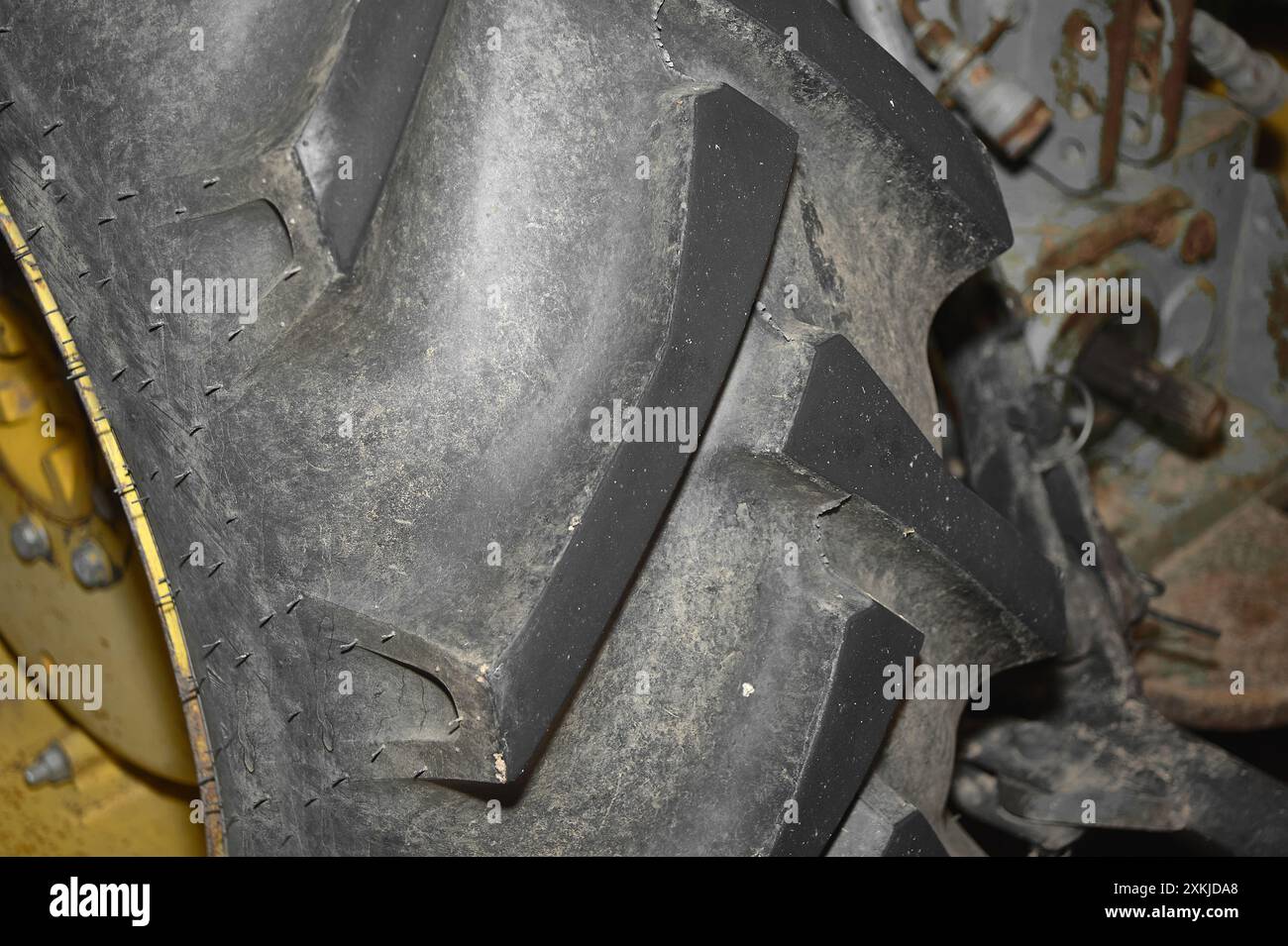 Close-up image of a tractor tire showing its texture and pattern. The ...