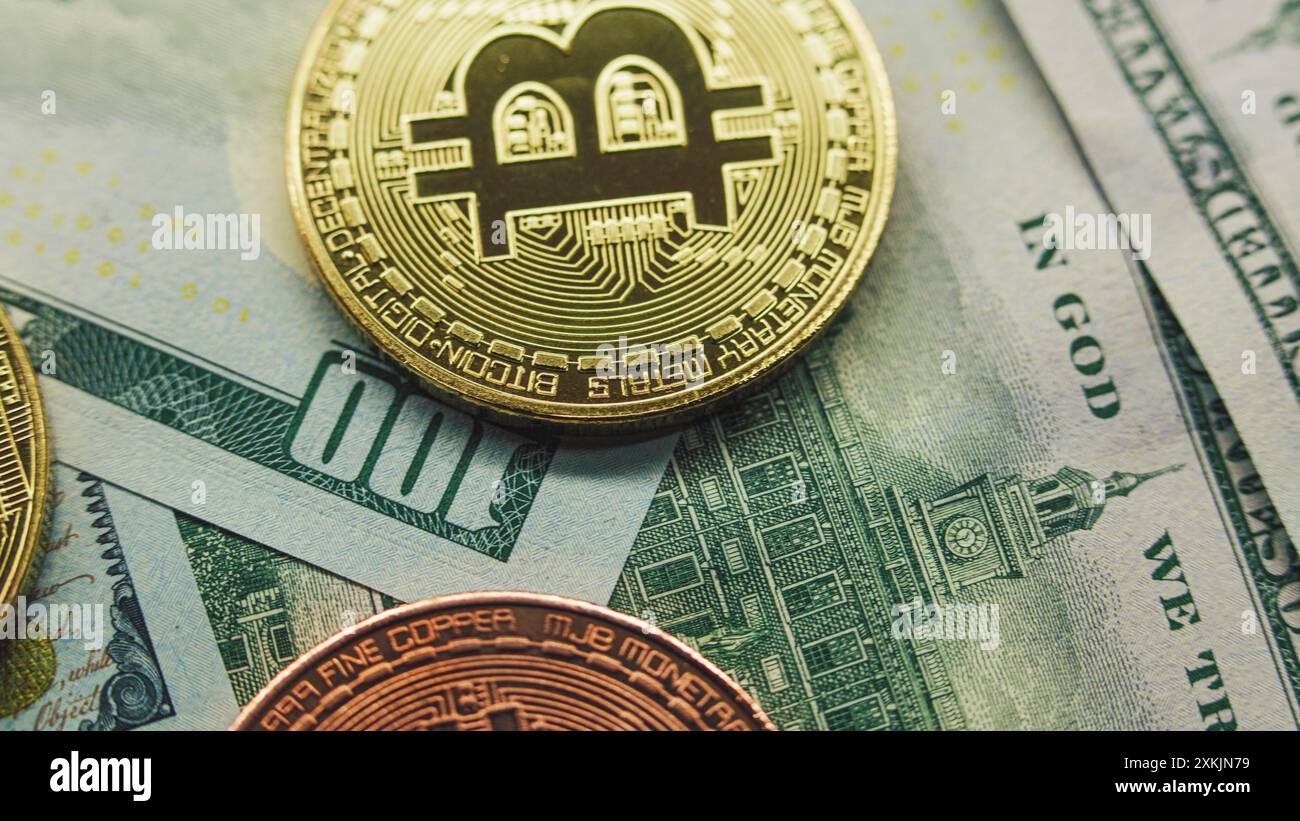 Bitcoin on 100 dollar bill background for design purpose Stock Photo - Alamy