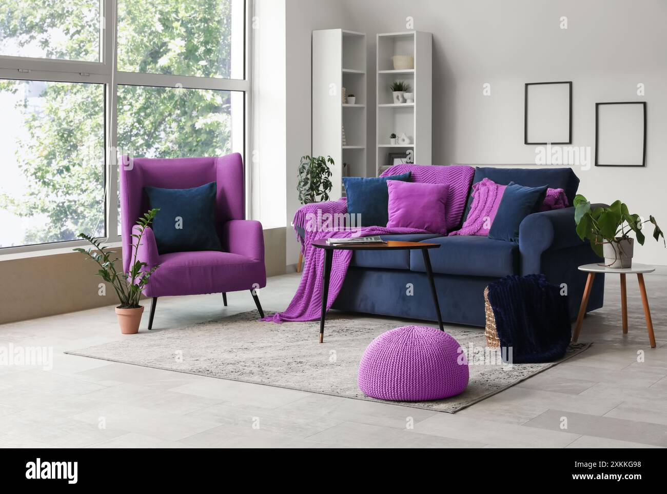 Modern interior of living room with stylish sofa and armchair Stock ...