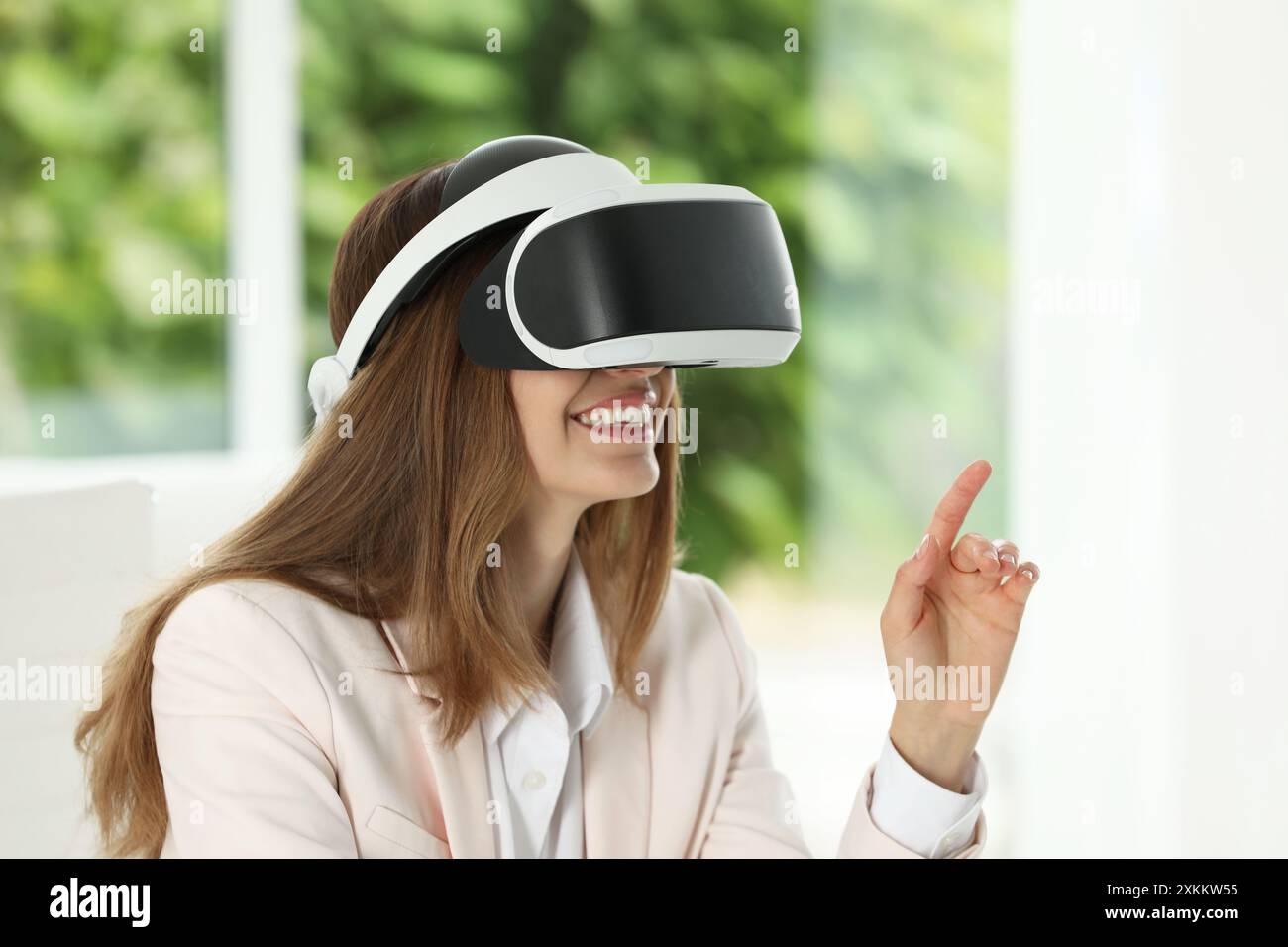 Female using augmented reality video hi-res stock photography and ...