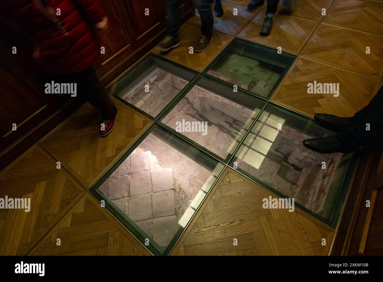 02.04.2024, Germany, Schleswig-Holstein, Luebeck - Fragment of medieval stairs under glass in Luebeck's historic town hall (UNESCO World Heritage Site Stock Photo