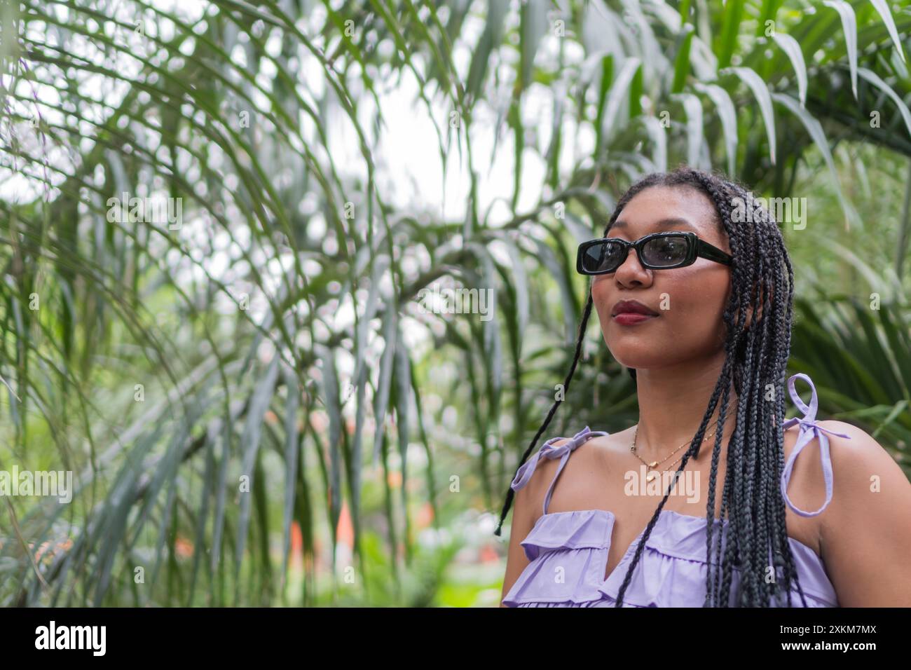 Calm african woman braids hi-res stock photography and images - Alamy