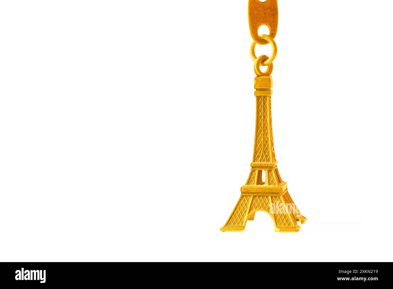 golden color Eiffel tower souvenir isolated on white background Stock ...