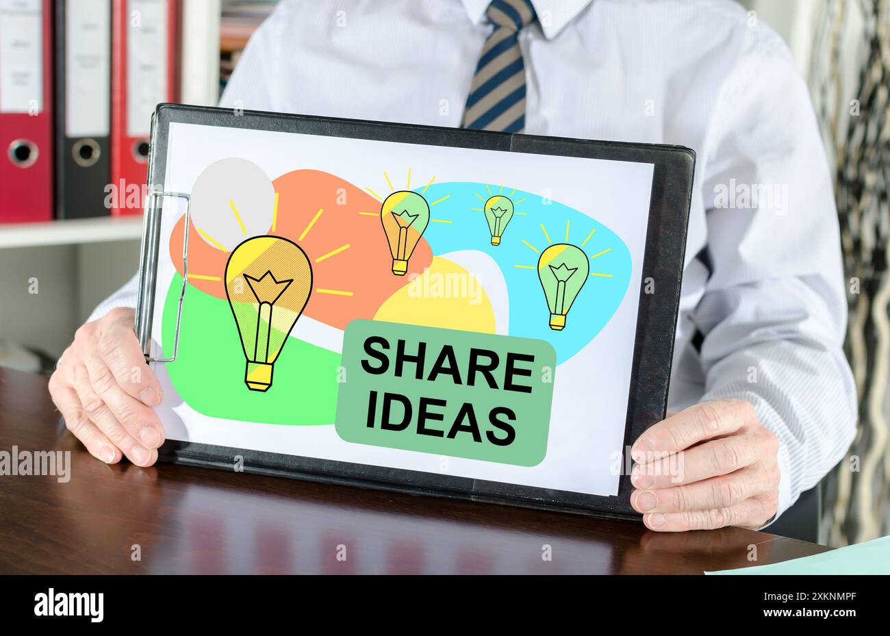 Share ideas concept shown by a businessman Stock Photo