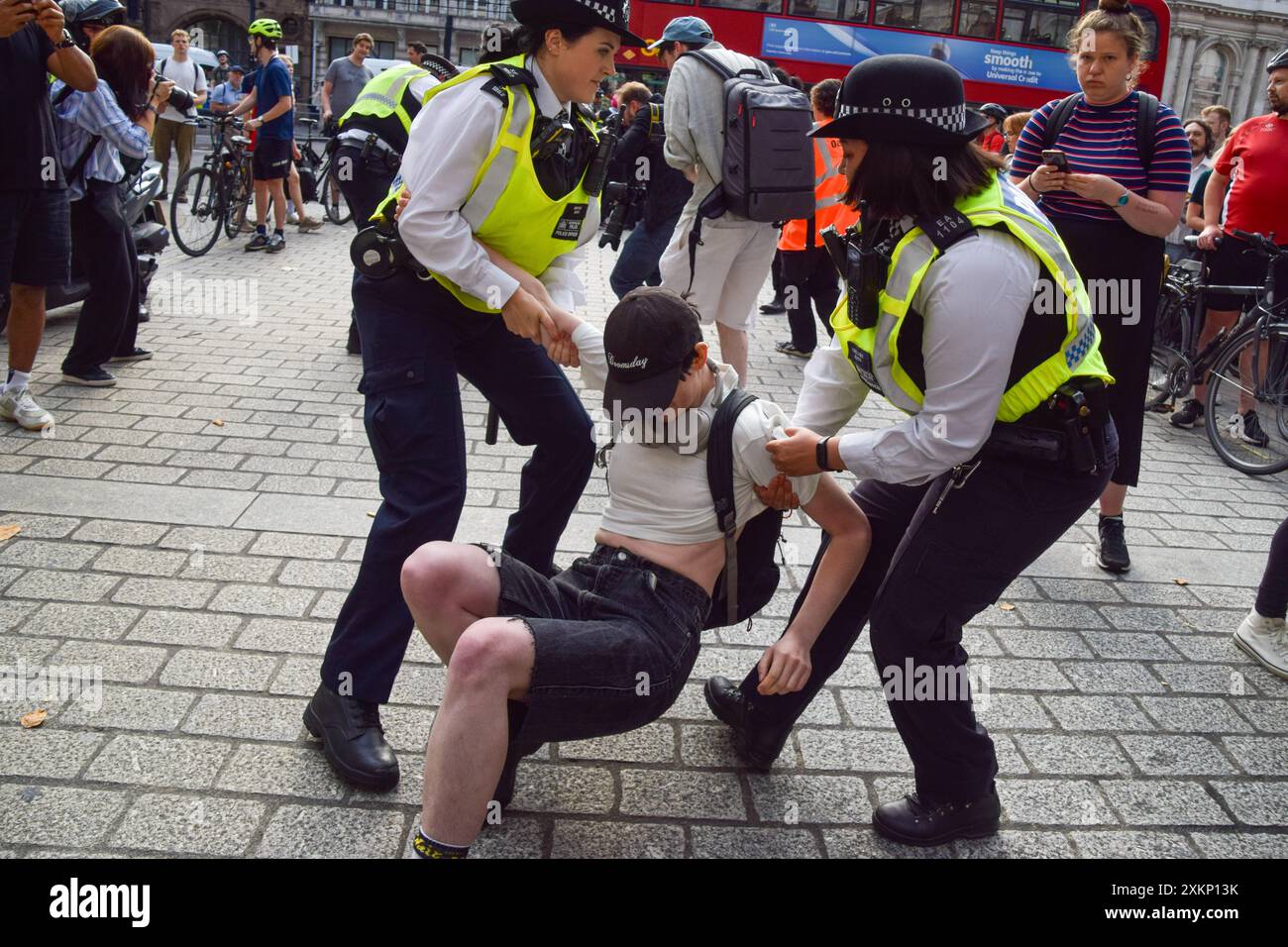 London, UK. 24th July 2024. Police officers arrest a protester. Pro ...