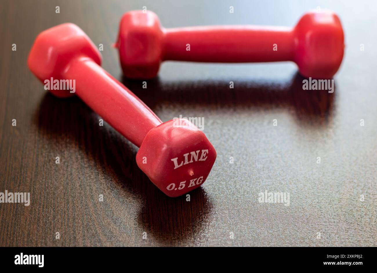 Two pink dumbbells. Stock Photo