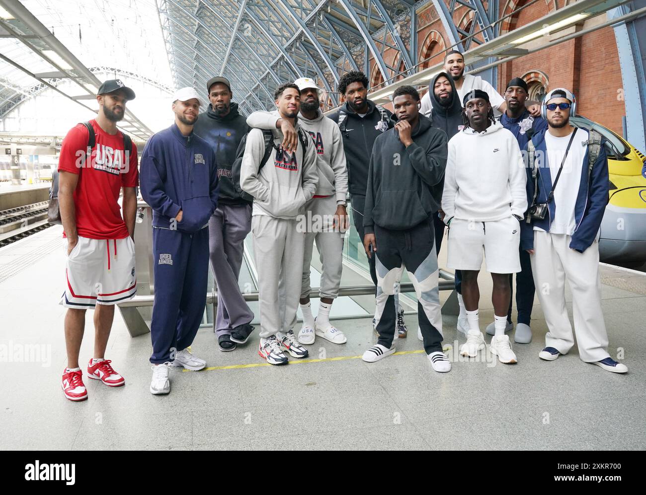 USA's Men's Olympic Basketball team (left to right) Derrick White , Steph Curry, Kevin Durant, Tyrese Haliburton, Lebron James, Joel Embiid, Anthony Edwards, Anthony Davis, Jayson Tatum (at back), Jrue Holiday, Bam Adebayo, and Devin Booker, at the Eurostar Terminal in London St. Pancras International as the team leave for the Paris 2024 Olympic Games. Picture date: Wednesday July 24, 2024. Stock Photo