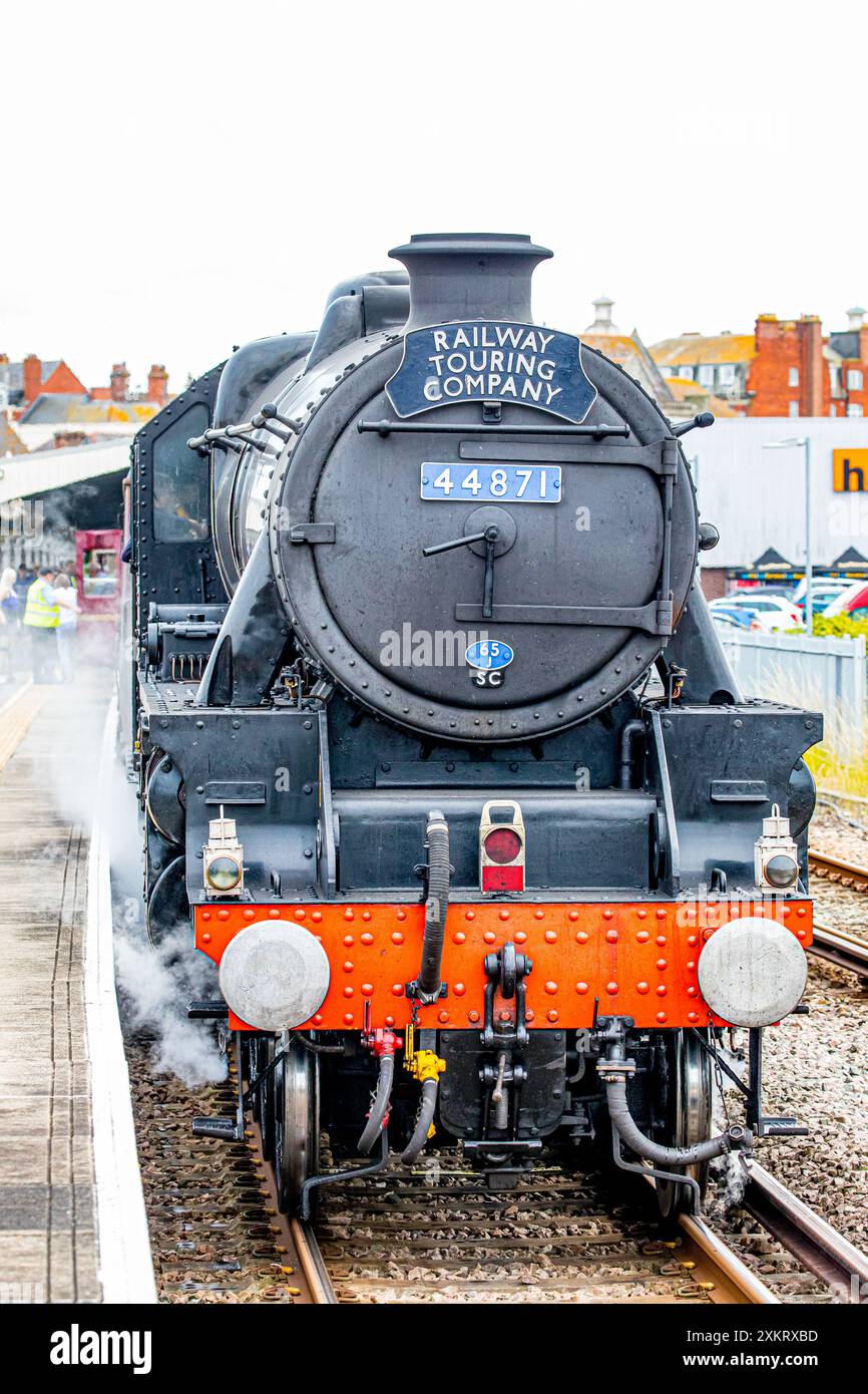 Weymouth, Dorset, UK, 24th July 2024. Black 5 class steam locomotive No. 44871 , driven by Andy Hawkins, arrived in Weymouth today Wednesday, July 24, 2024 from London Victoria via Bournemouth, Poole, Wareham and Dorchester.  The Dorset Coast Express train, operated by the Railway Touring Company, gives visitors almost three and a half hours in Weymouth to discover this lovely traditional seaside town. Credit John Rose Photography/Alamy Live News Stock Photo