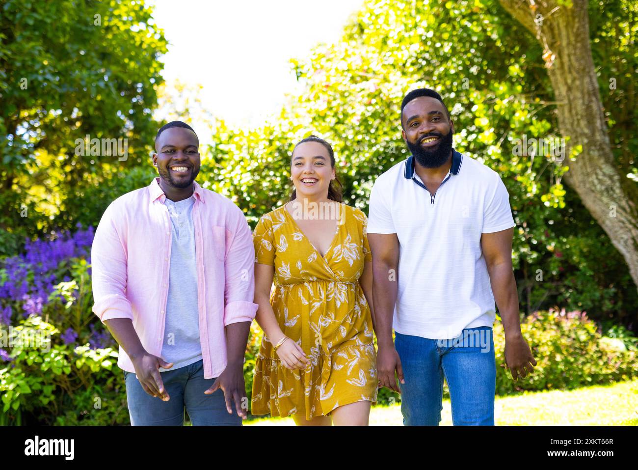 Friends walking together in the park hi-res stock photography and ...