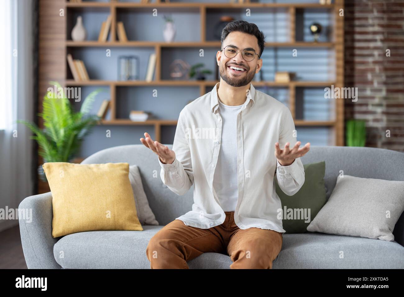 Happy indian man inviting people hi-res stock photography and images ...