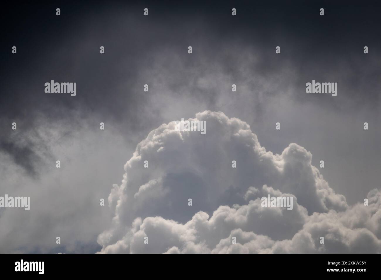 Storm cloud formation background in shades of grey and white Stock Photo