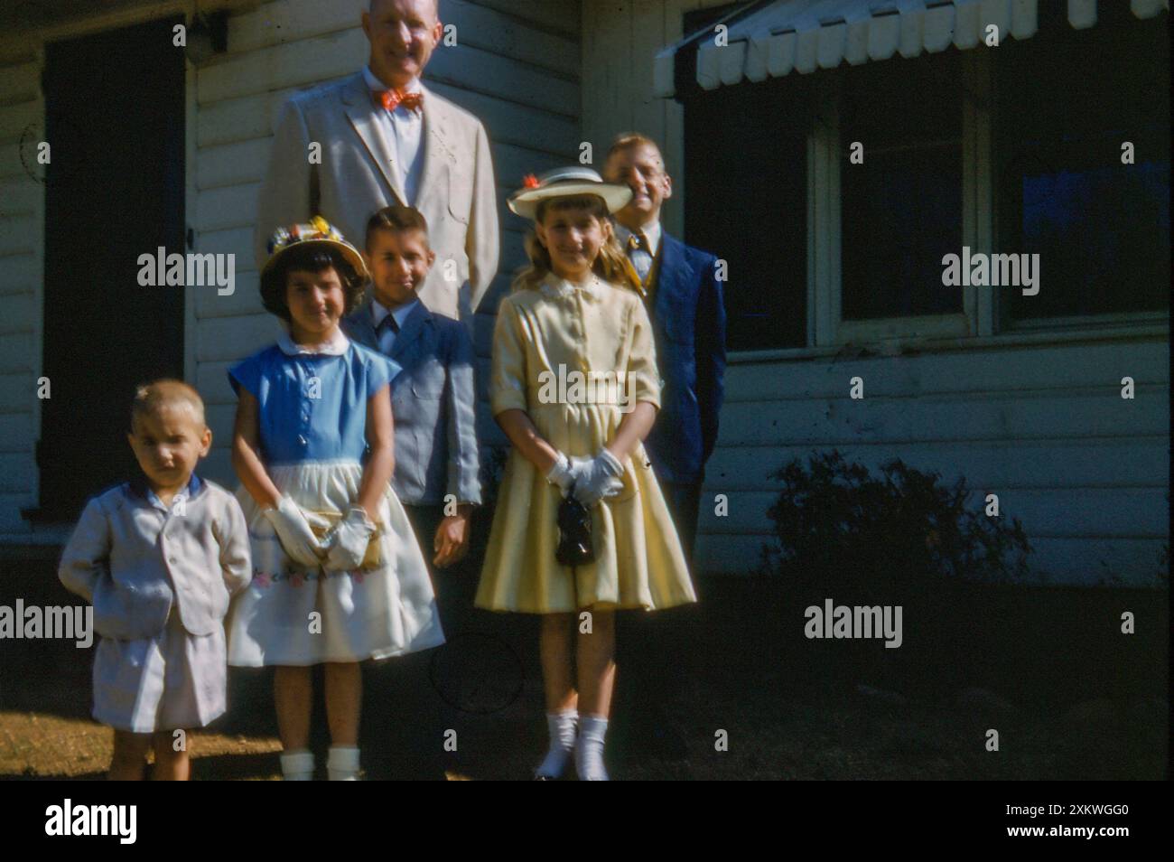 family posing in front of their home on Easter Sunday, , 1960, Atlanta, Georgia, USA Stock Photo