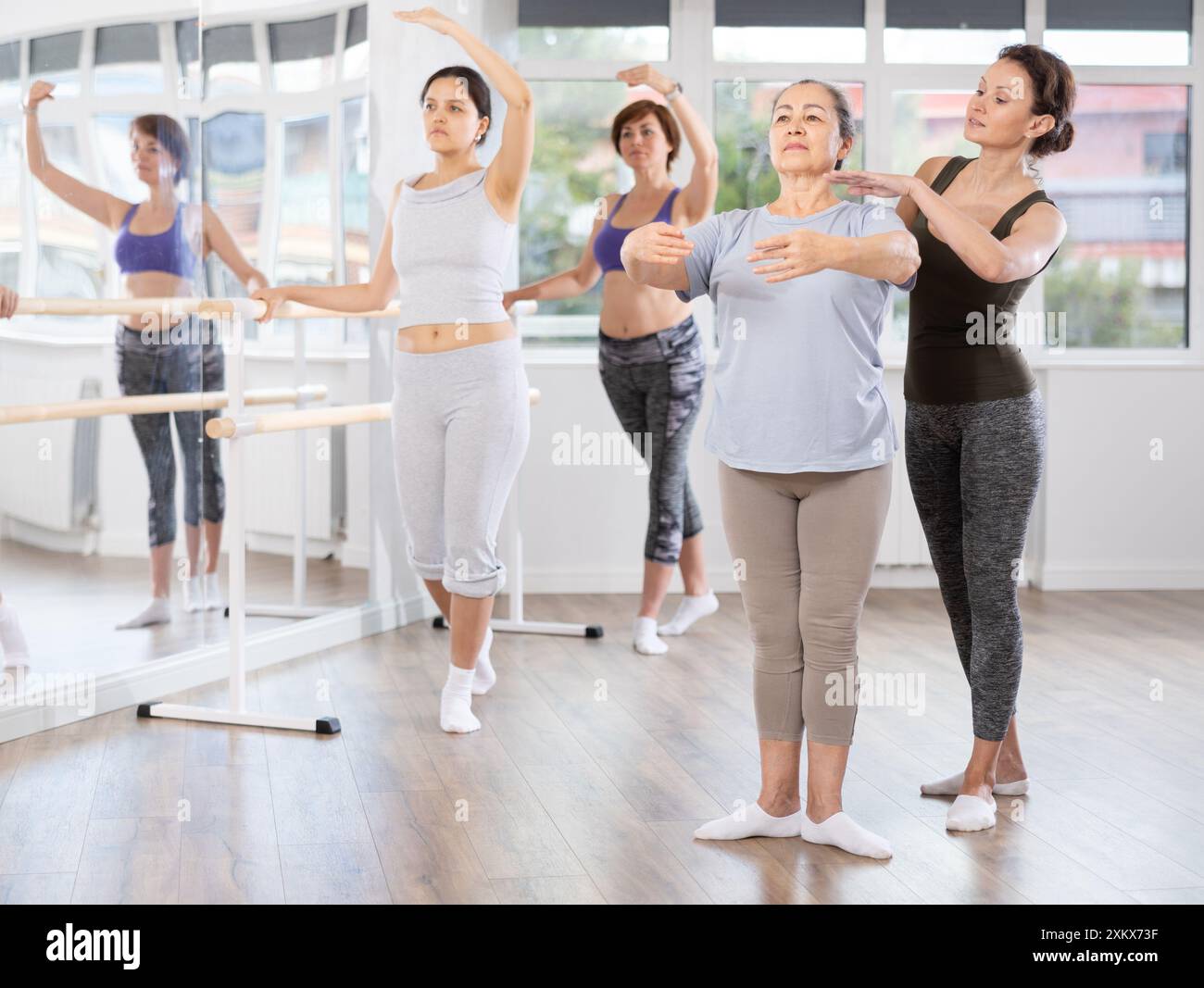 Ballet lesson for amateurs - choreographer teaches women of different ...