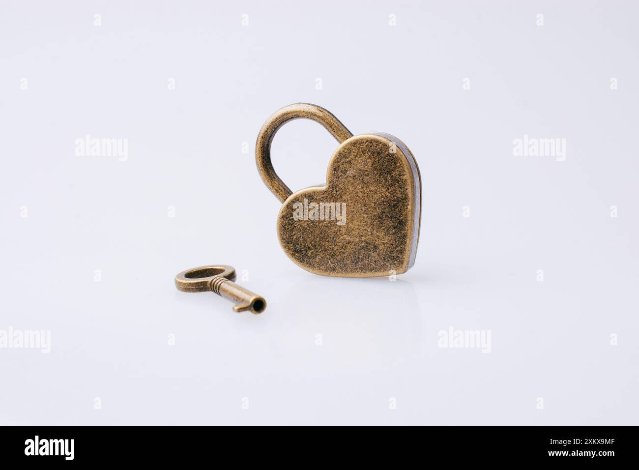 Metal padlock in heart shape as symbol of love Stock Photo - Alamy