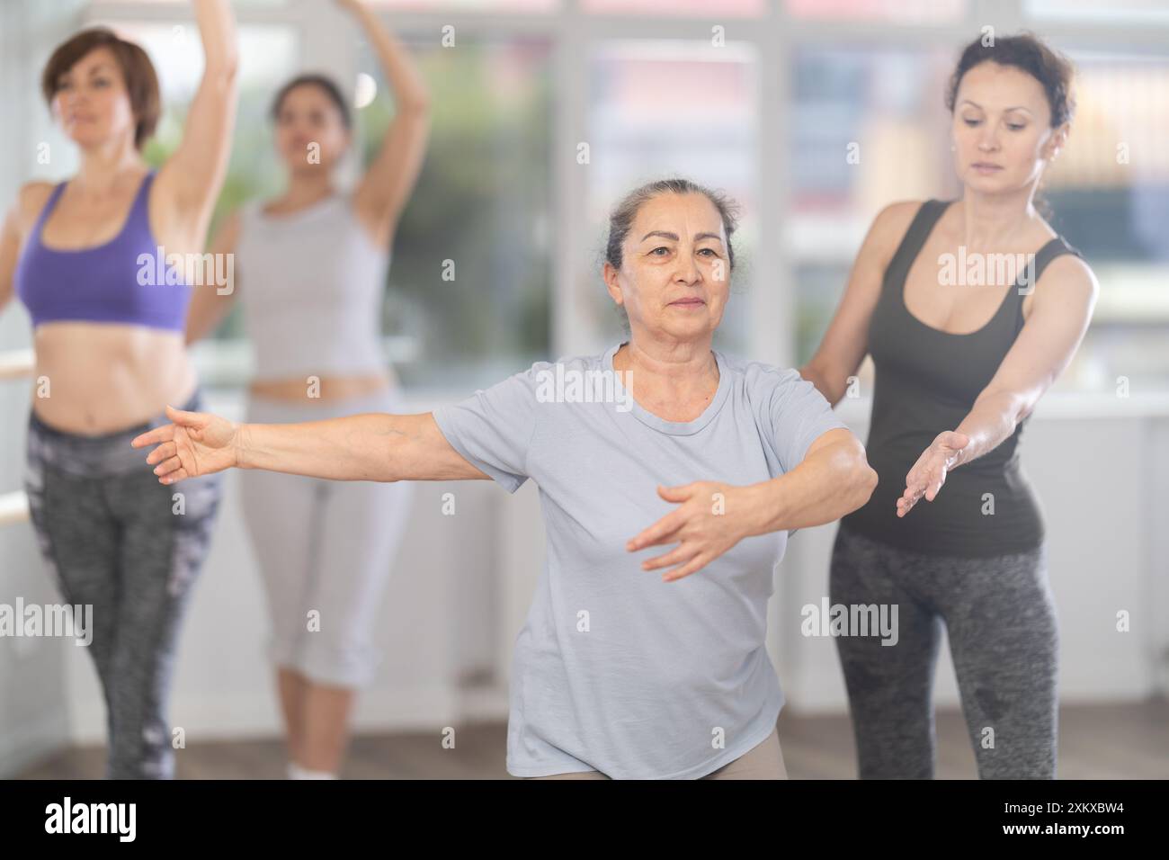 Ballet lesson for amateurs - choreographer teaches women of different ...