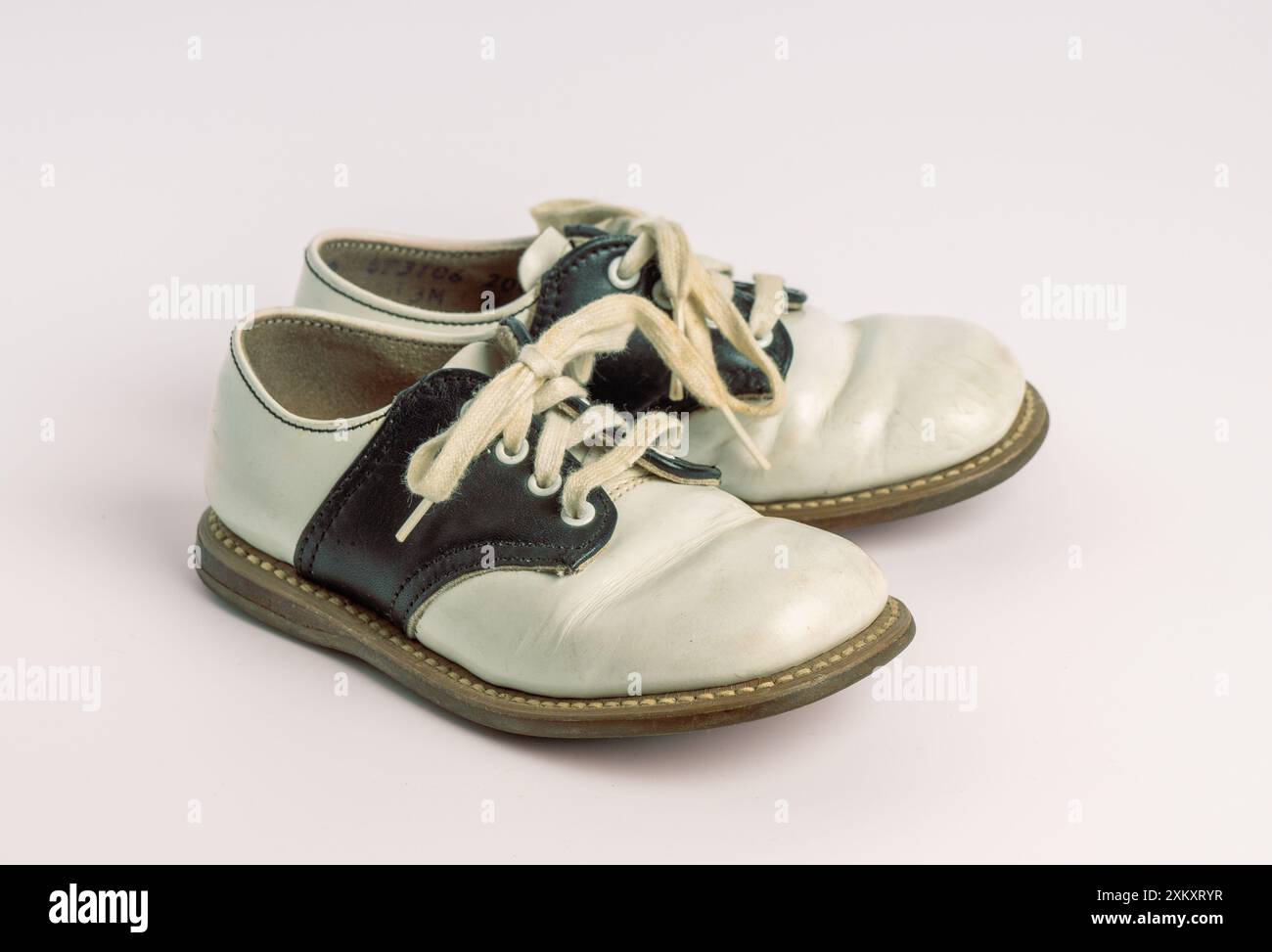 Black and white baby / toddler saddle shoes Stock Photo - Alamy