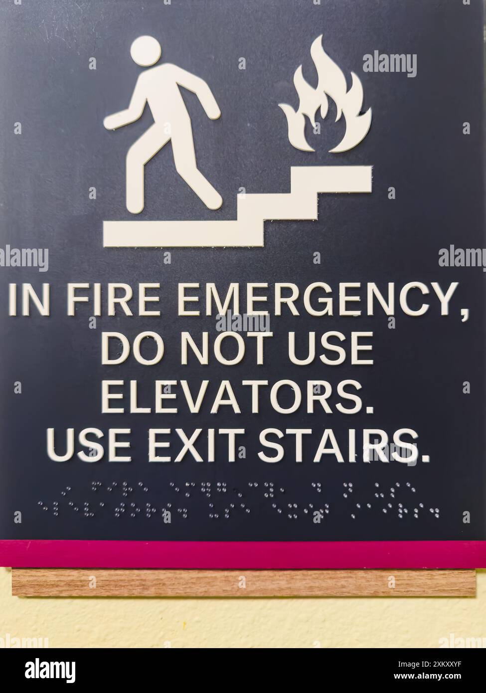 Santa Maria, California, USA - July 21, 2024. Fire emergency sign indicating to use exit stairs instead of elevators. Stock Photo