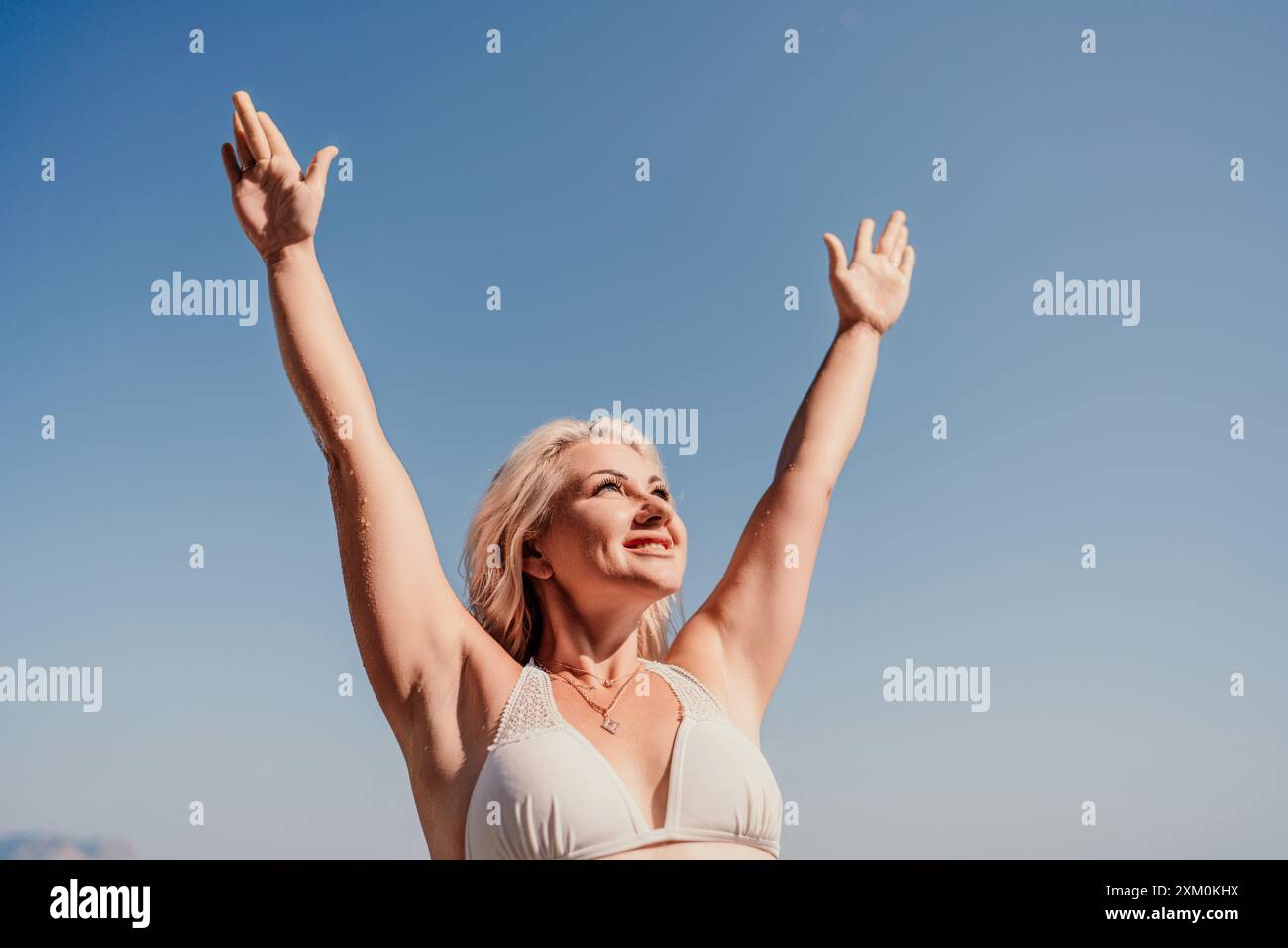 Old woman happy arms in air hi-res stock photography and images - Alamy