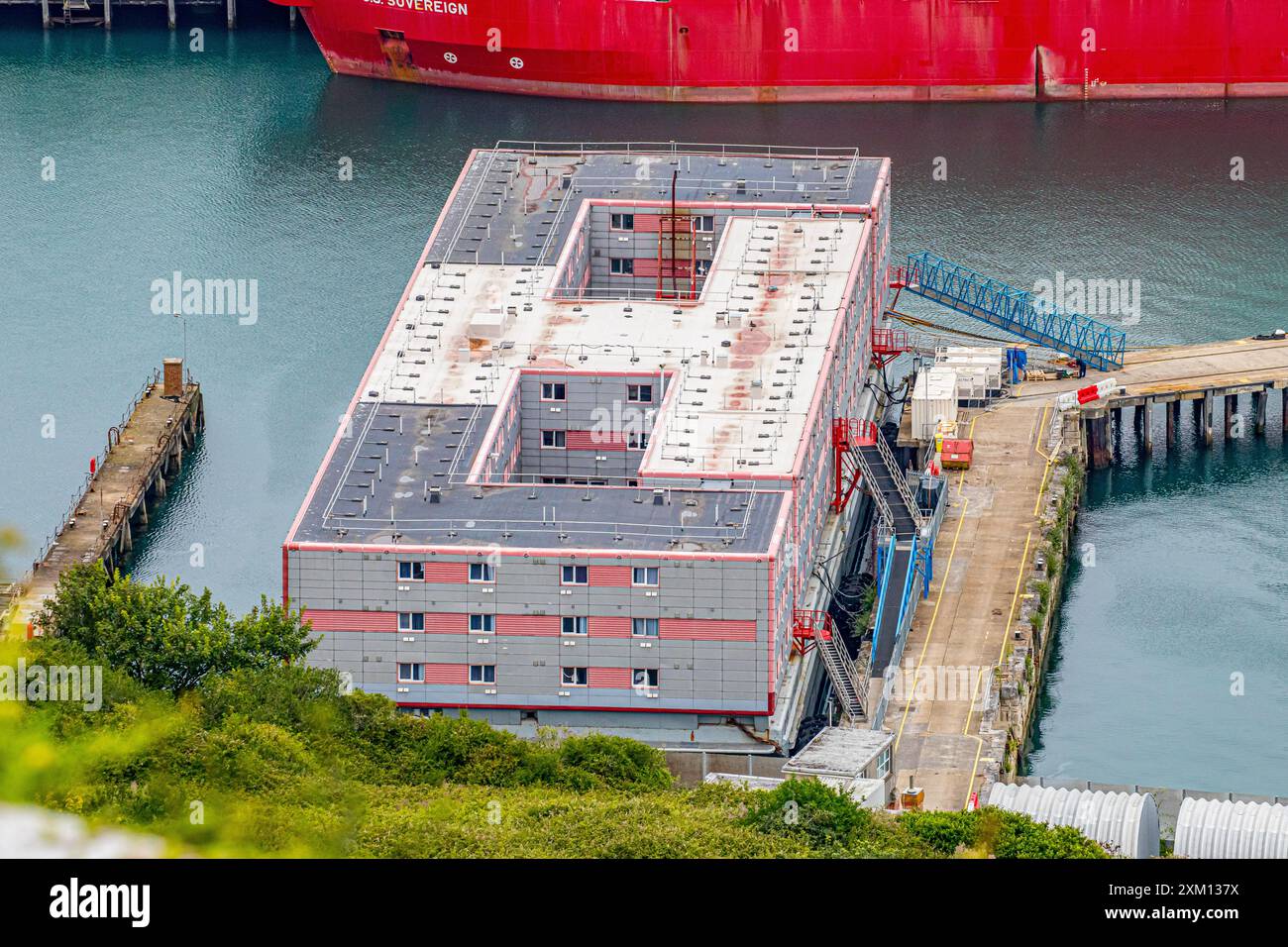 General view from above of the Bibby Stockholm asylum seekers barge / refugee ship at Portland Port near Weymouth. Dorset, England, UK Stock Photo