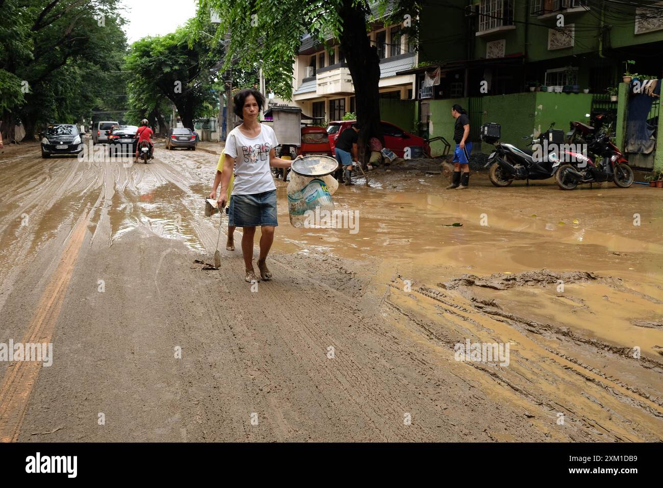 On July 25, 2024, residents of Marikina, Philippines, clean their homes, salvage products and personal belongings ruin by dirt and mud after heavy rain and flooding from Typhoon Gaema, locally named Carina. Copyright: xDeoxMontesclarosx Stock Photo