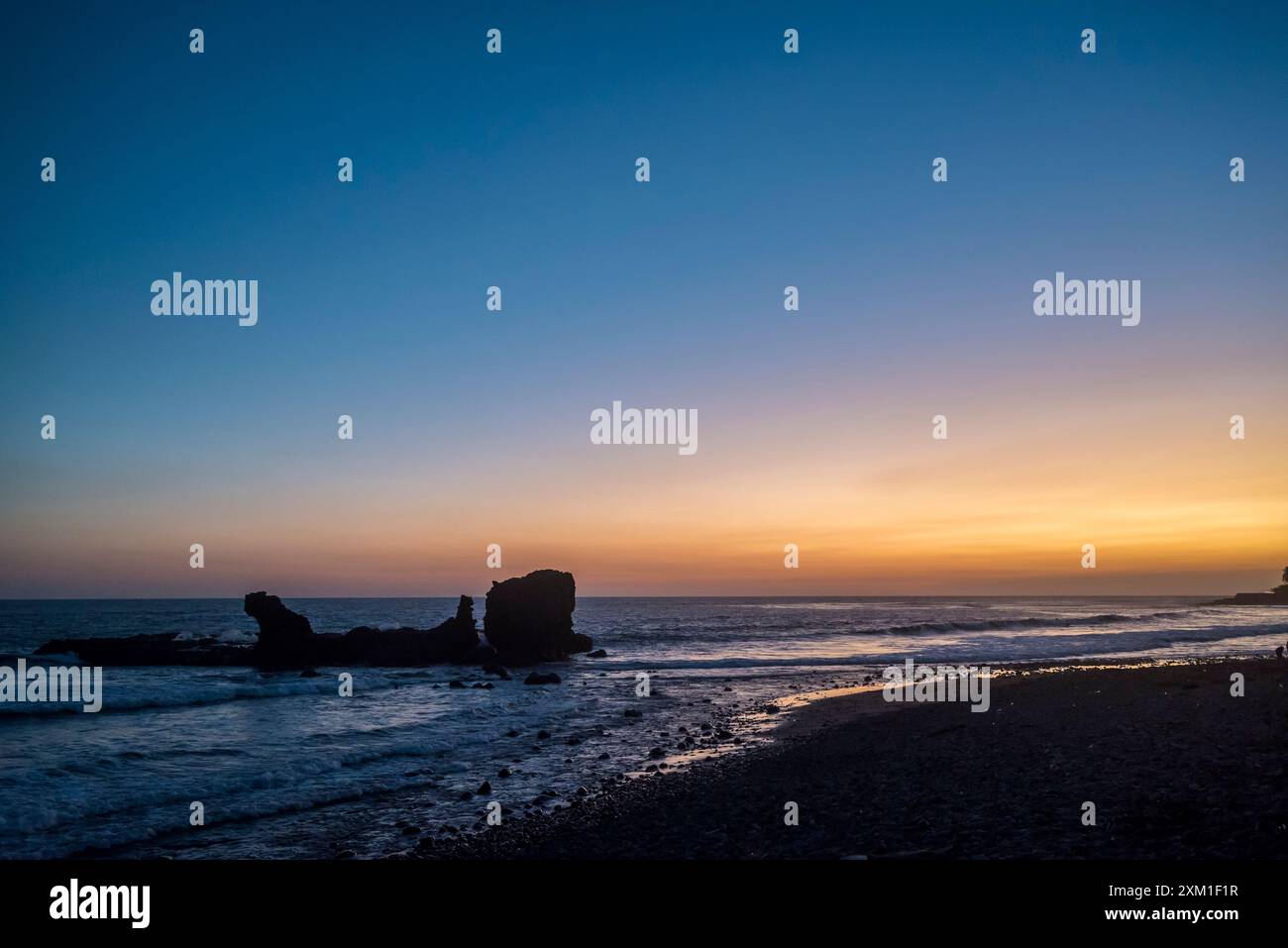 Twilight at the beach in El Tunco, surf town on the Pacific coast, El Salvador, Central America Stock Photo
