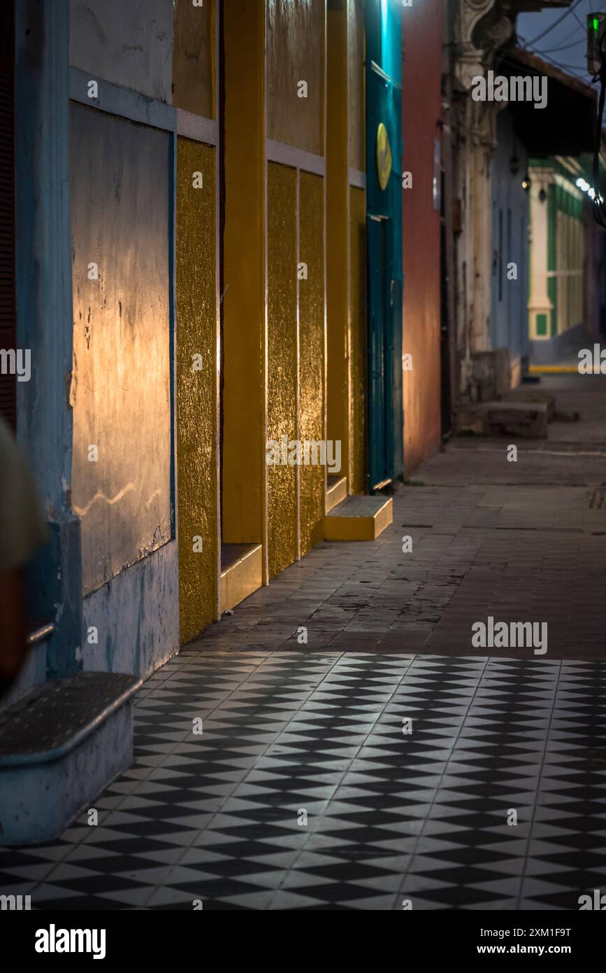 Colonial style street in the city centre at dusk, Granada, Nicaragua Stock Photo