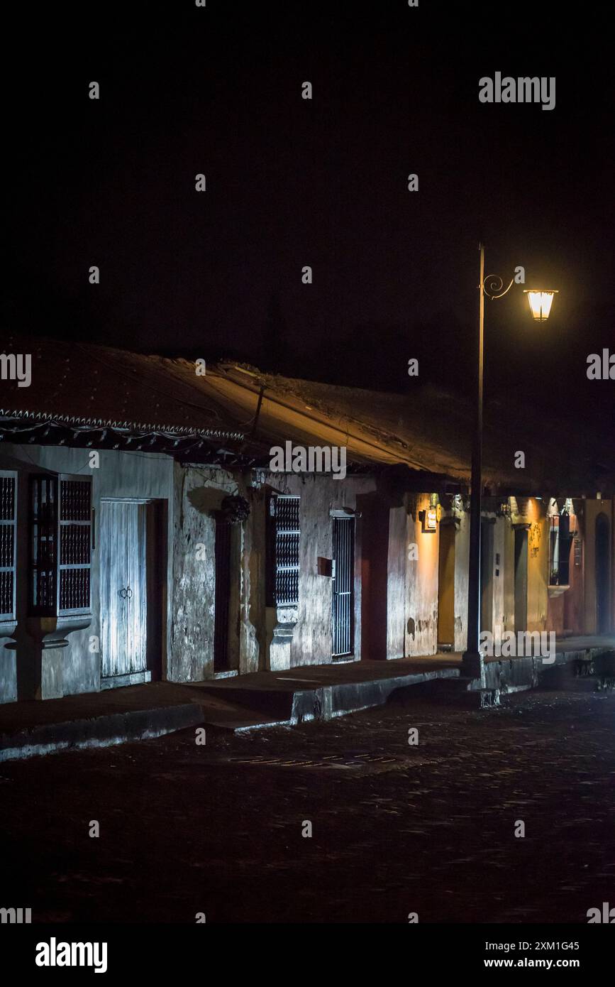 Street at night in the Spanish colonial-era city centre, Antigua, Guatemala, Central America Stock Photo