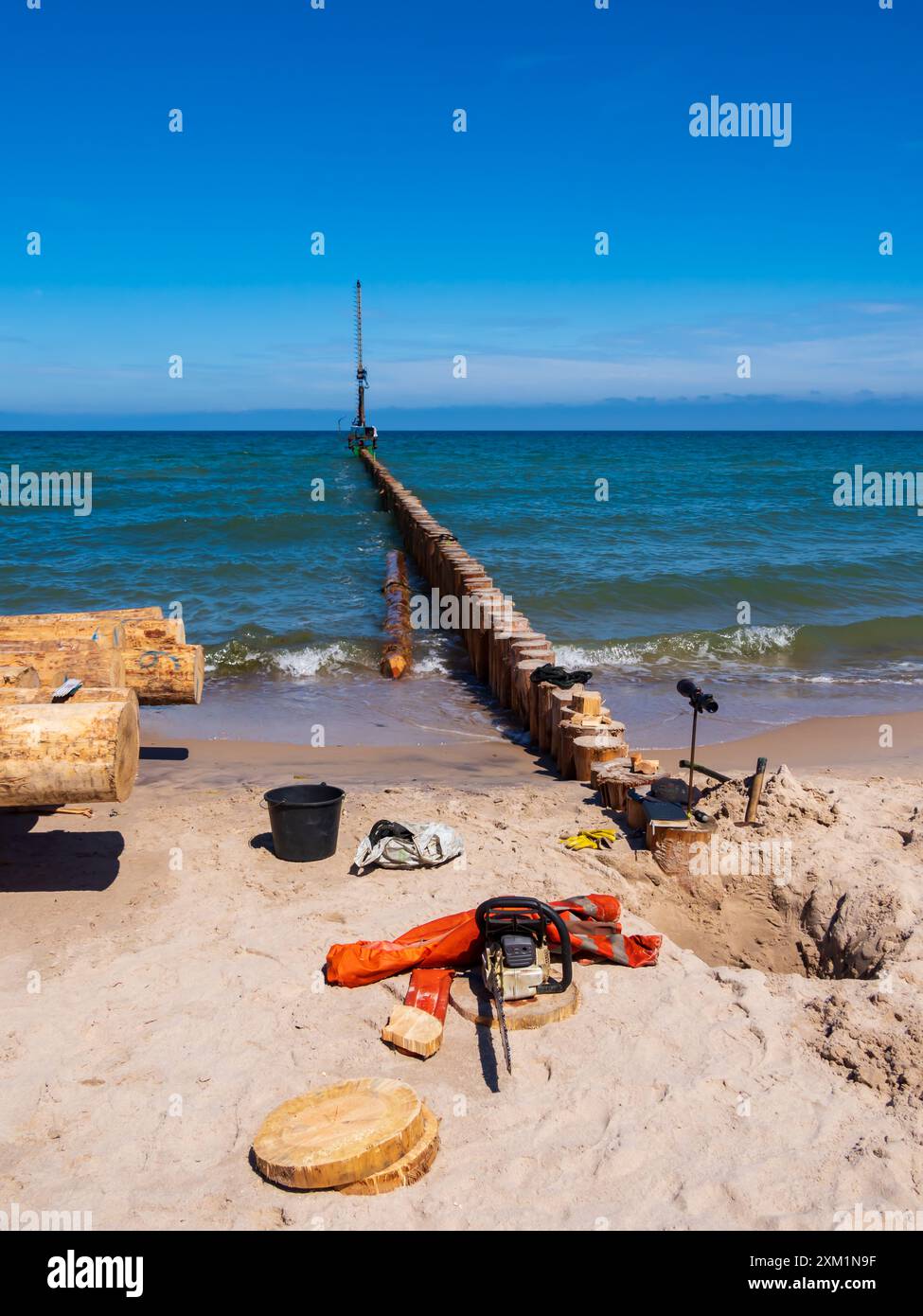 Mielno, Poland - June 2022: Huge wooden logs and tools for building a ...
