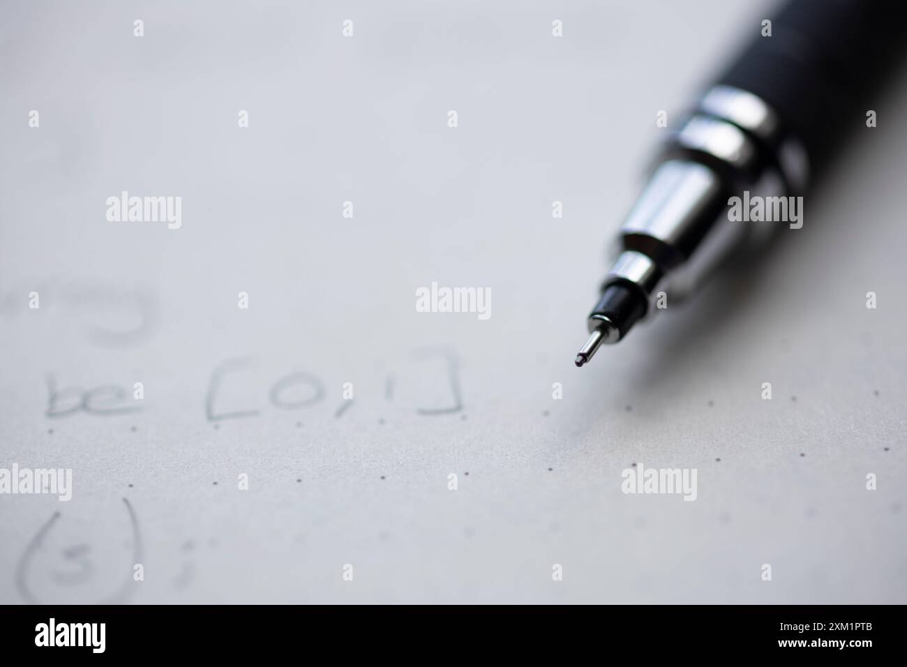 Mechanical pencil on a dotted notepad Stock Photo