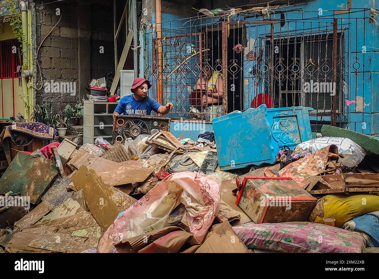 Marikina City, Philippines. 25th July, 2024. Locals salvage their ...