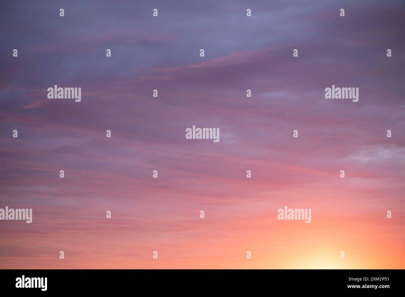 Sunrise sky above a city. Incredible natural colors. Red, orange, purple, dark blue. Heaven. Stock Photo