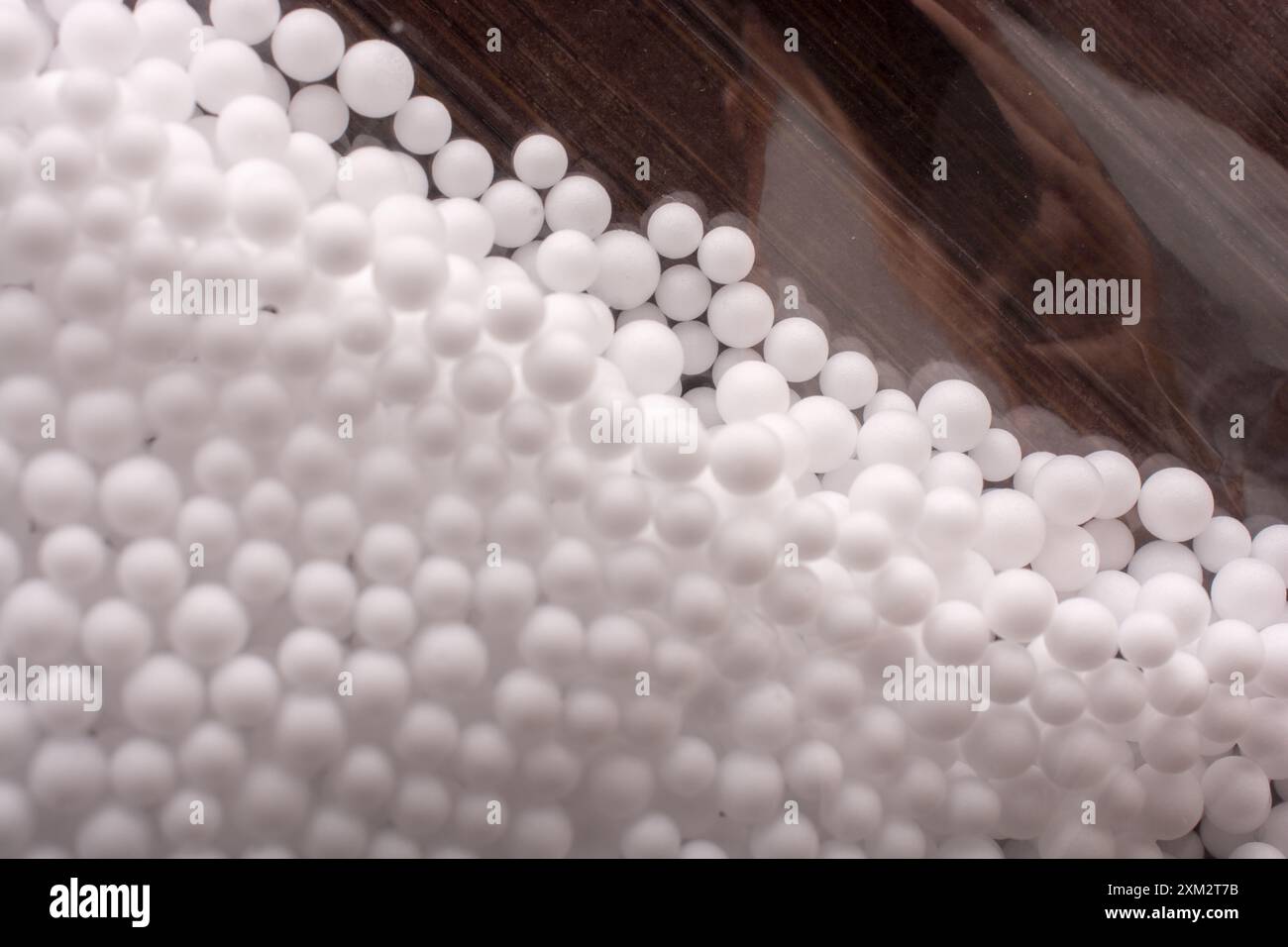White little polystyrene foam balls as background Stock Photo - Alamy