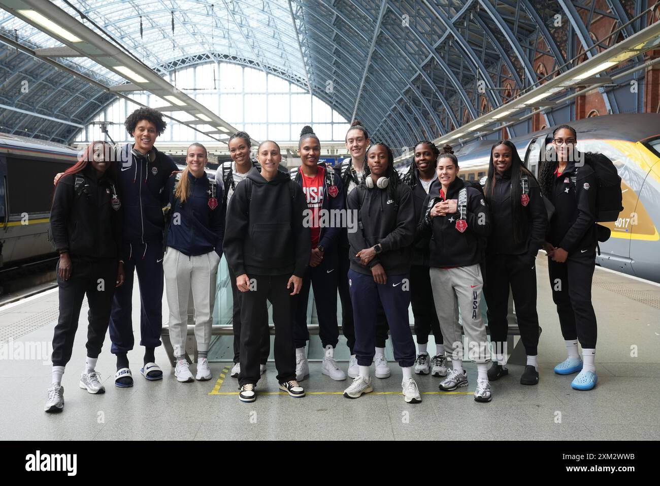 Members of the women's USA Olympics basketball team (left to right) Kahleah Copper, Brittney Griner, Sabrina Ionescu, Napheesa Collier, Diana Taurasi, Alyssa Thomas, Breanna Stewart, Jewell Lloyd, Chelsea Gray, Kelsey Plum, Jackie Young and A'ja Wilson at the Eurostar Terminal in London St. Pancras International as they leave for the Paris 2024 Olympic Games. Picture date: Thursday July 25, 2024. Stock Photo