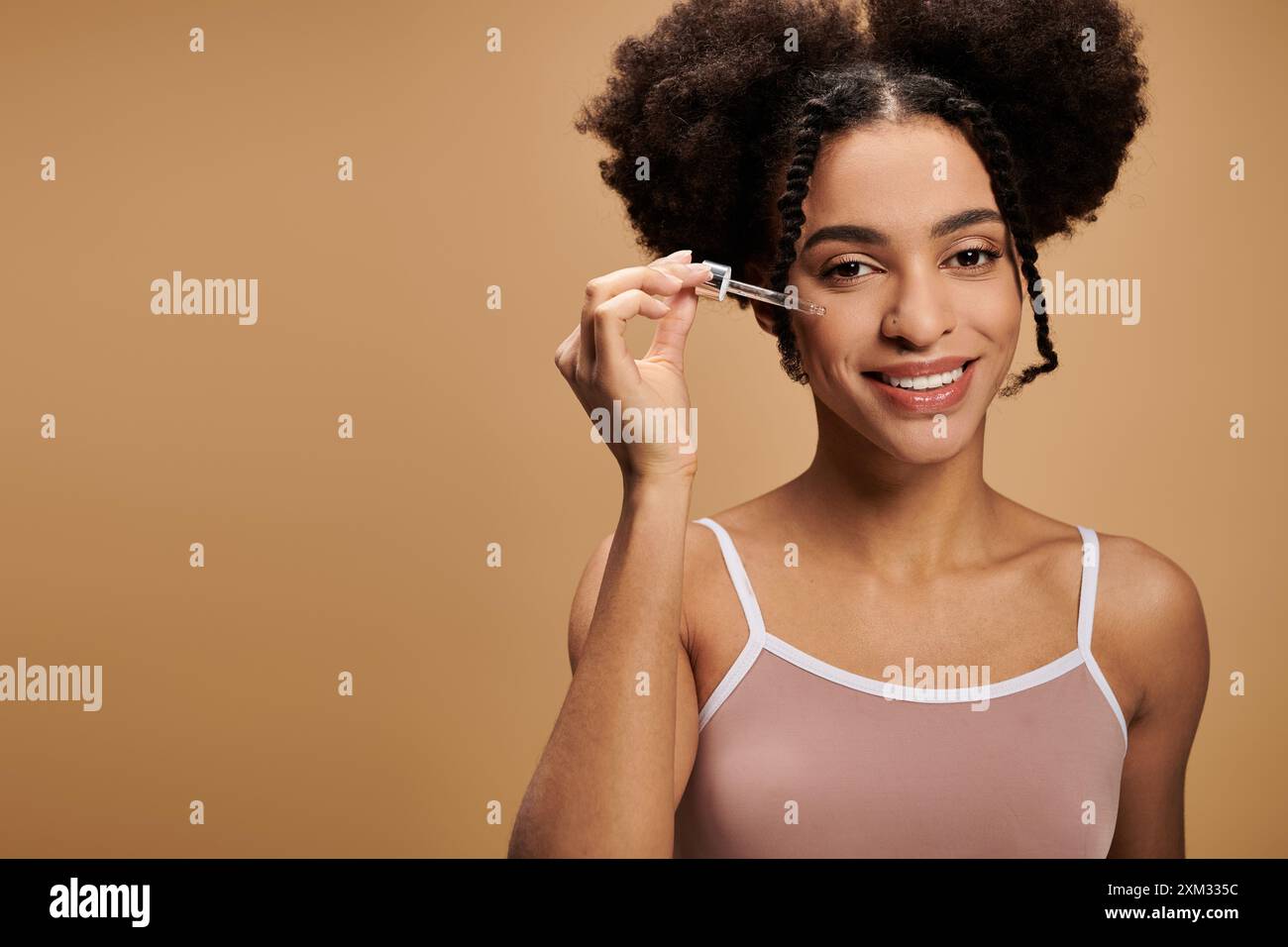 African american applies serum hi-res stock photography and images - Alamy