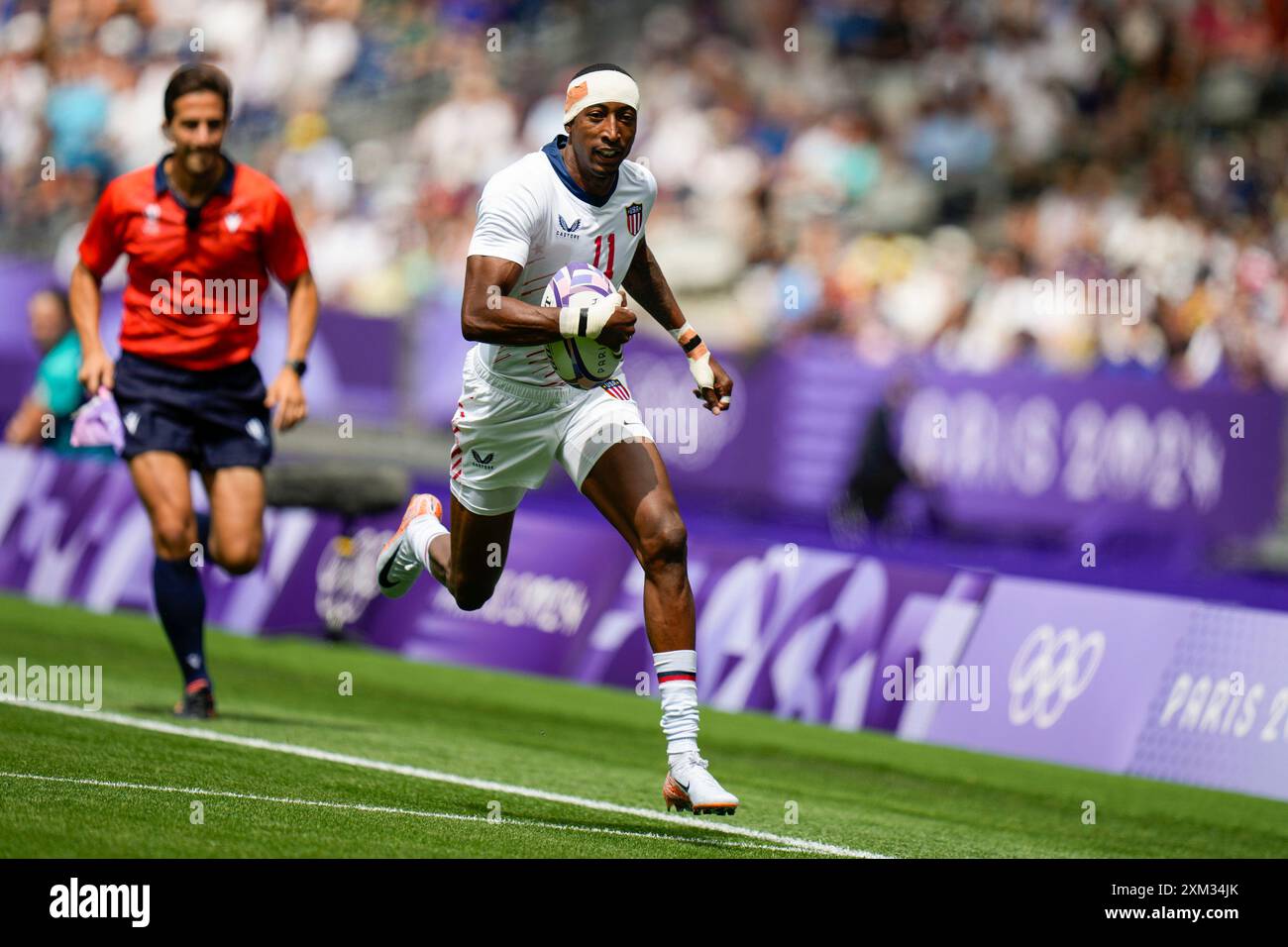 Paris, France. 25th July, 2024. Perry Baker of Team USA runs in to ...
