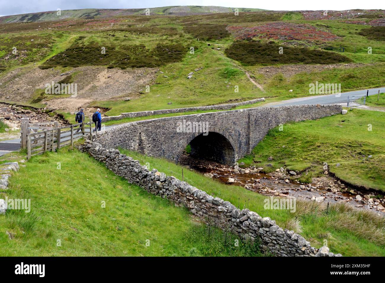 Long Distance Paths Uk Two Men Walking Across Surrender Bridge near Wainwrights Coast to Coast ...