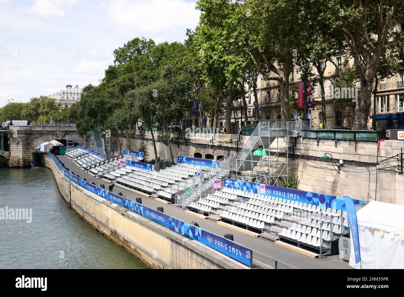 Paris, France. 25th July, 2024. Review stands along the Seine river in Paris on hursday in preparation for Friday evening's opening ceremonies for the Paris Olympics. Athletes who will float on barges along the Seine to make their entrance for the Games. Credit: Adam Stoltman/Alamy Live News Stock Photo