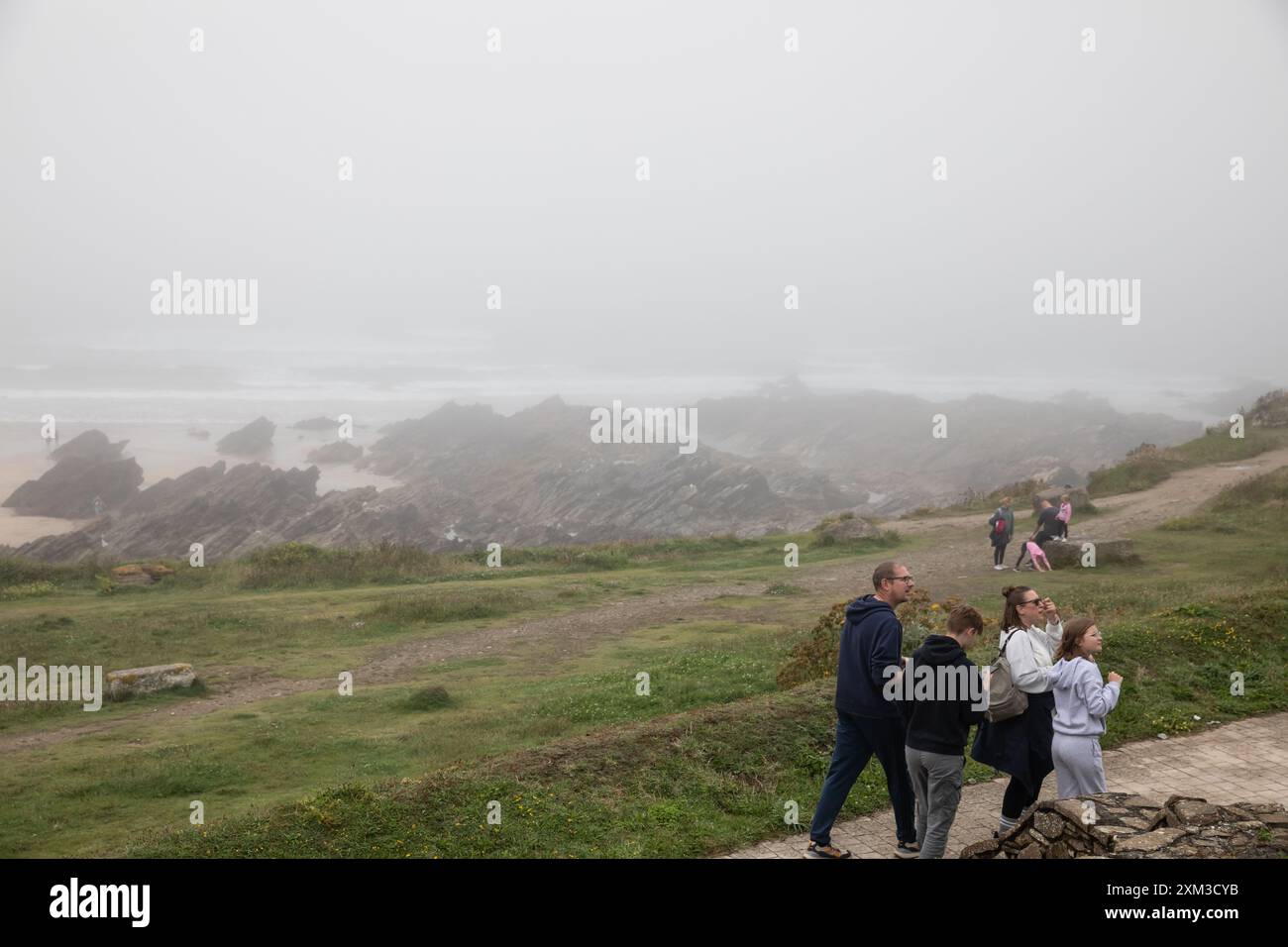 Newquay, Cornwall, 25th July 2024, Fistral Beach in Newquay, Cornwall was deserted today on a Grey Day with Sea Mist. The beach is famous as People travel from all over the country to ride the famous waves with great surfing conditions. Credit: Keith Larby/Alamy Live News Stock Photo