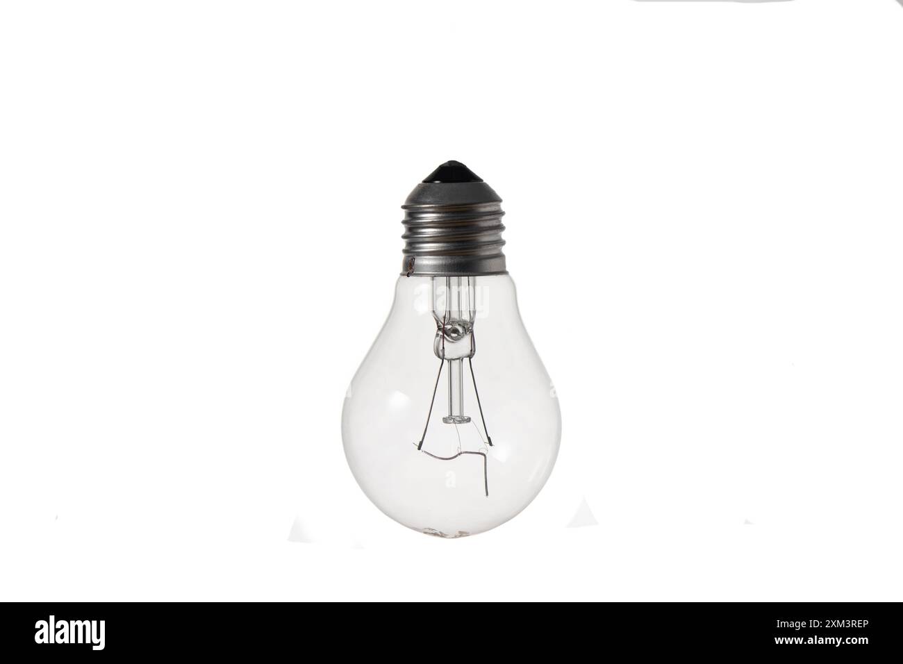 Close-up image of an incandescent lamp with a burned out spiral on a white background. Stock Photo